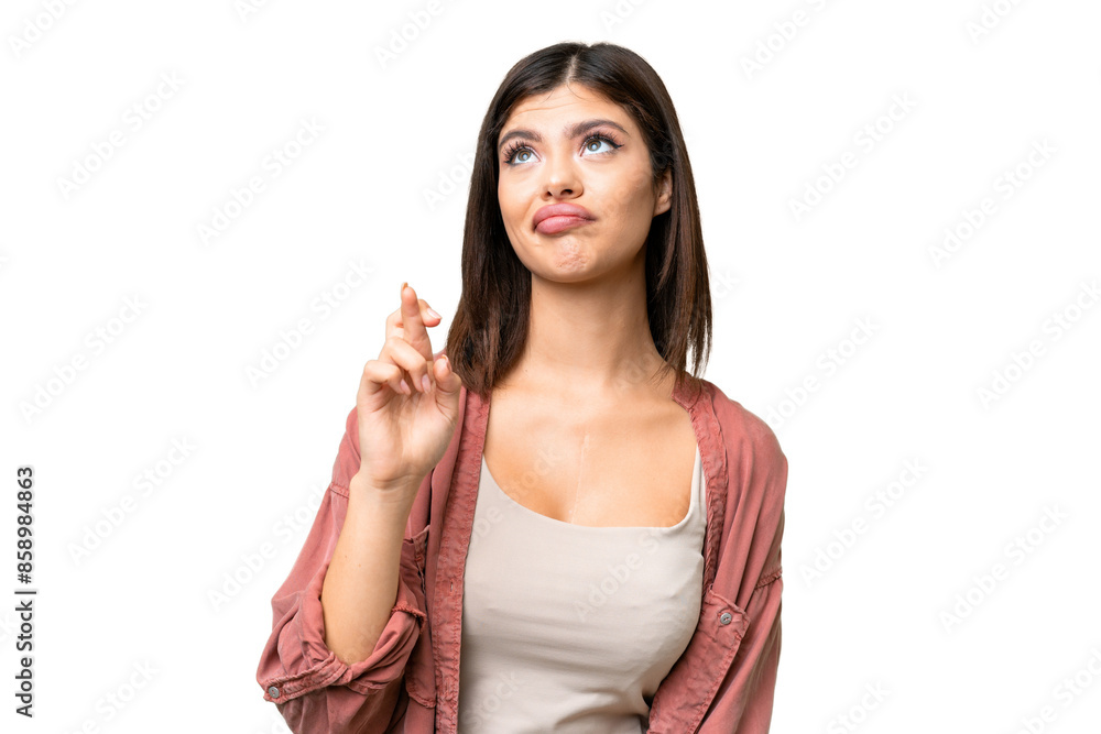 Young Russian woman over isolated chroma key background with fingers crossing and wishing the best Young Russian woman over isolated chroma key background with fingers crossing and wishing the best