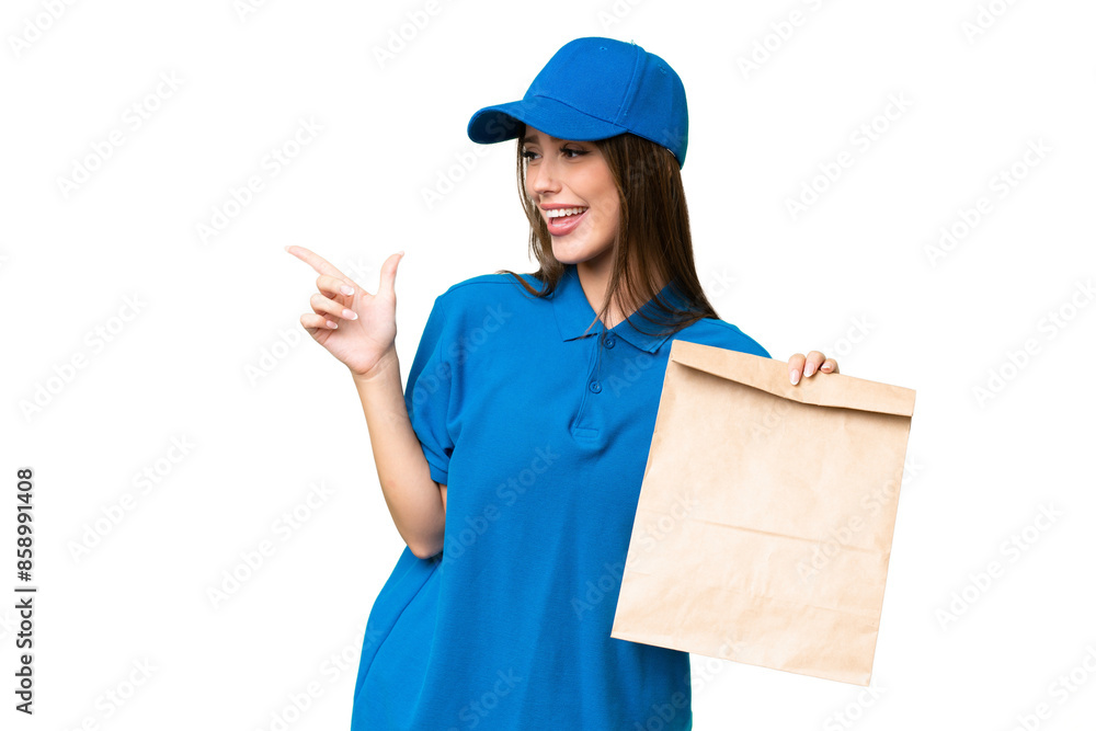 Young beautiful caucasian woman taking a bag of takeaway food over isolated background pointing finger to the side and presenting a product Young beautiful caucasian woman taking a bag of takeaway food over isolated background pointing finger to the side and presenting a product