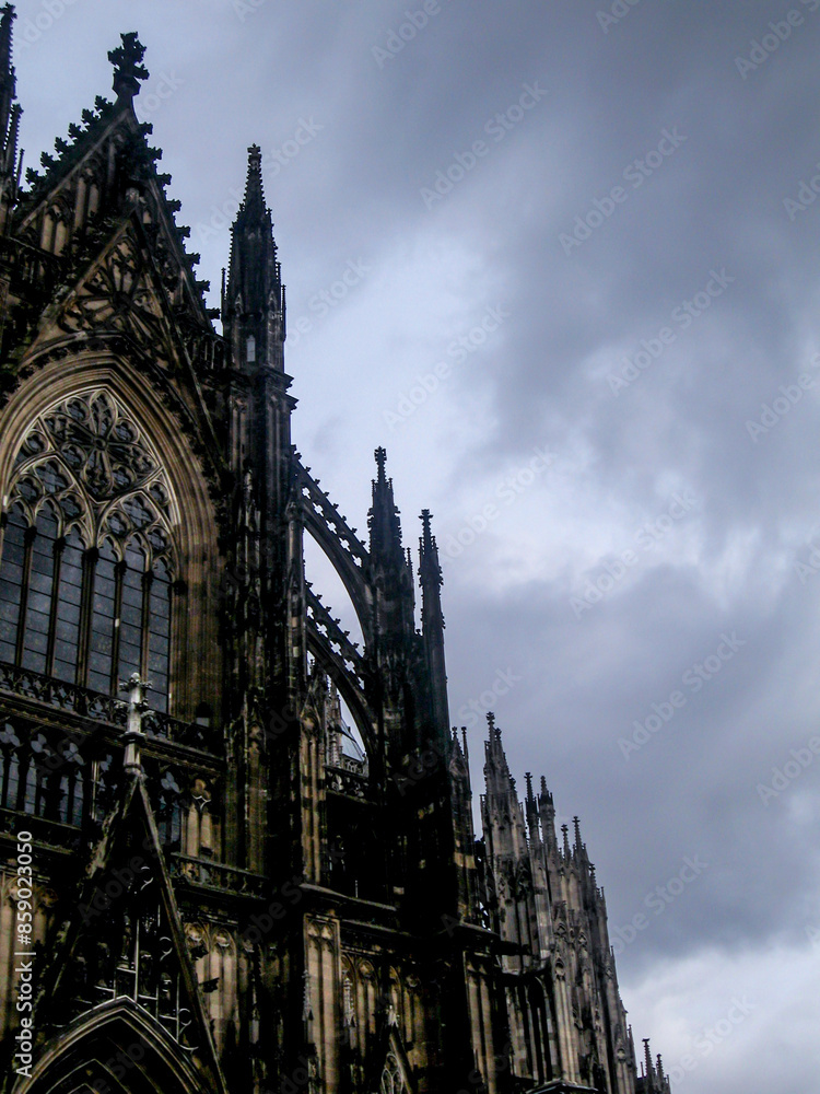 Fototapeta premium Cologne Cathedral against the dark and ominous stormy sky