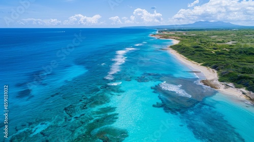 The coastline with azure blue waters and pristine white beaches stretching as far as the eye can see.