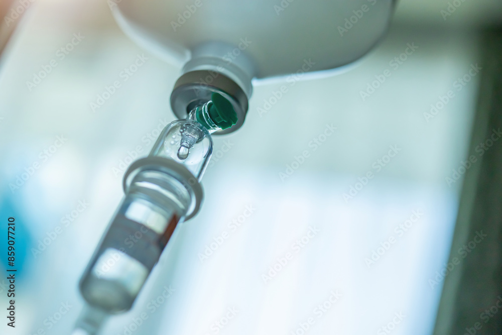 Close up medical intravenous IV drip in hospital background Close up medical intravenous IV drip in hospital background