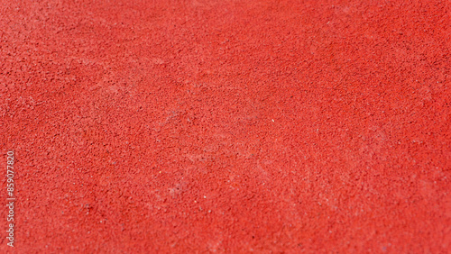 Top angle view of red tennis court texture. Red tennis field background. 