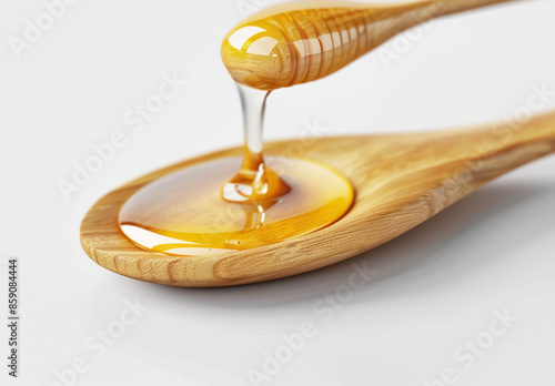 Honey dripping from a wooden dipper 