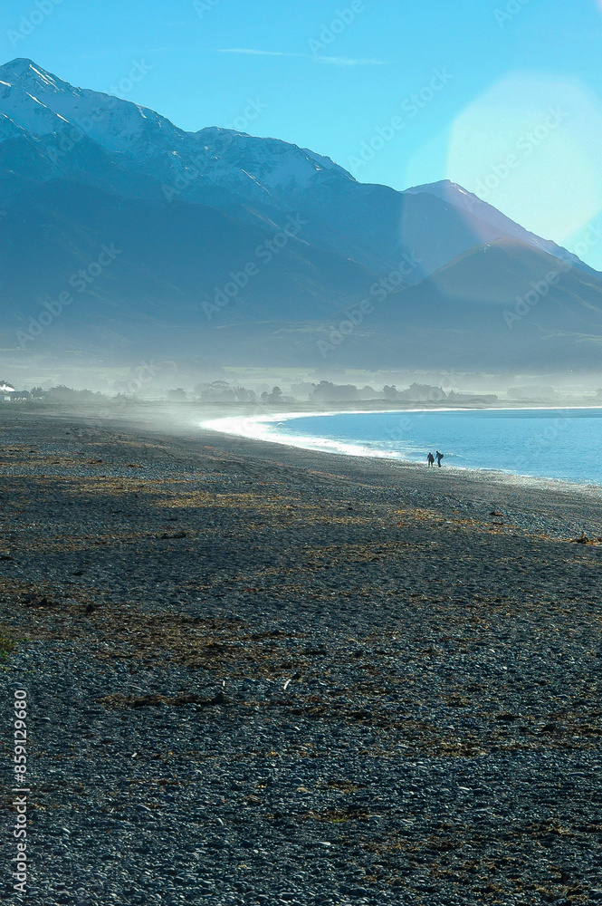 Strolling on the beach under the winter sun in New Zealand Strolling on the beach under the winter sun in New Zealand