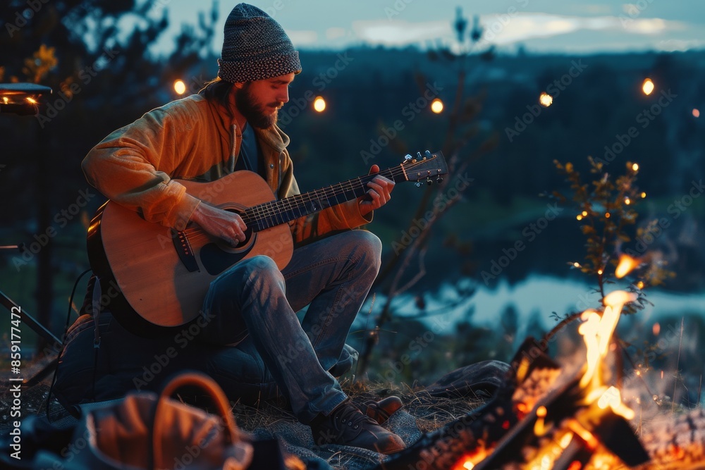 Fototapeta premium Guitarist by Campfire at Dusk
