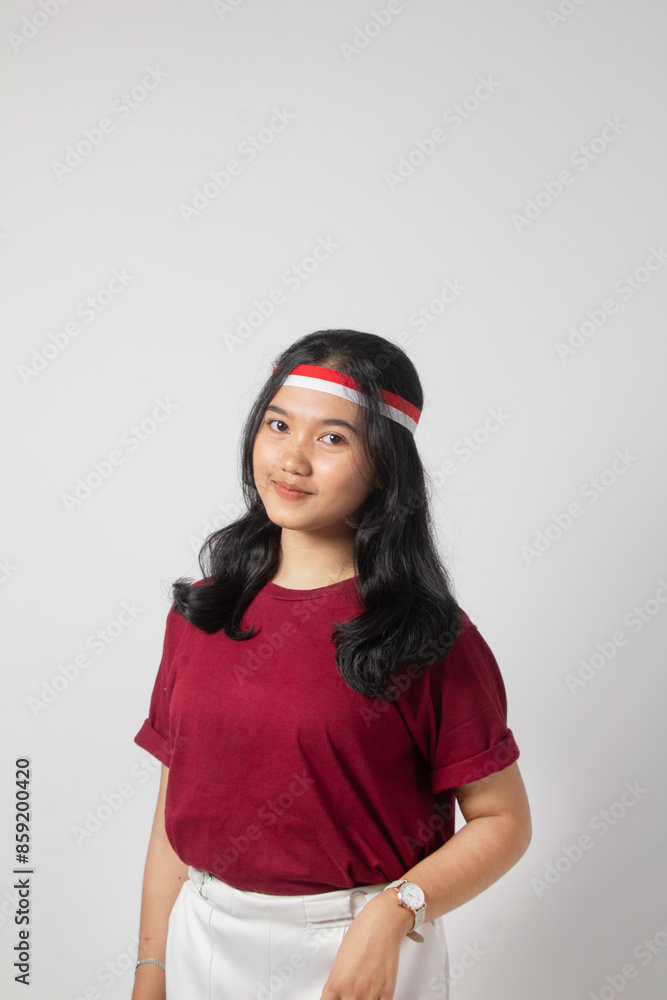closeup crop photo Young beautiful woman in a maroon t-shirt looking at the camera while smiling broadly, Indonesian woman concept closeup crop photo Young beautiful woman in a maroon t-shirt looking at the camera while smiling broadly, Indonesian woman concept