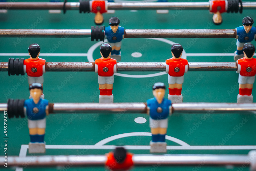 Fototapeta premium Foosball game, red and blue player - Sport leisure theme
