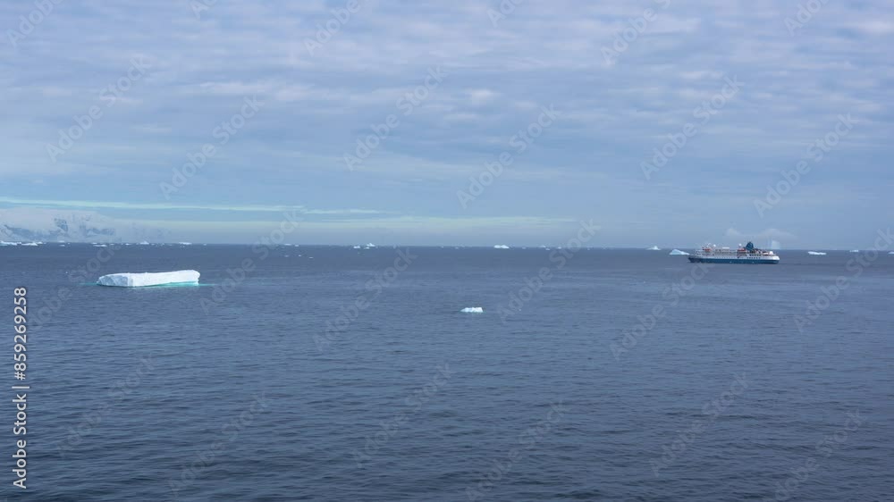 Antarctica Blue and White Cruise Ships Sails Across Water With Icebergs Expedition Vessel Travel Tourism Ocean Antarctica Blue and White Cruise Ships Sails Across Water With Icebergs Expedition Vessel Travel Tourism Ocean