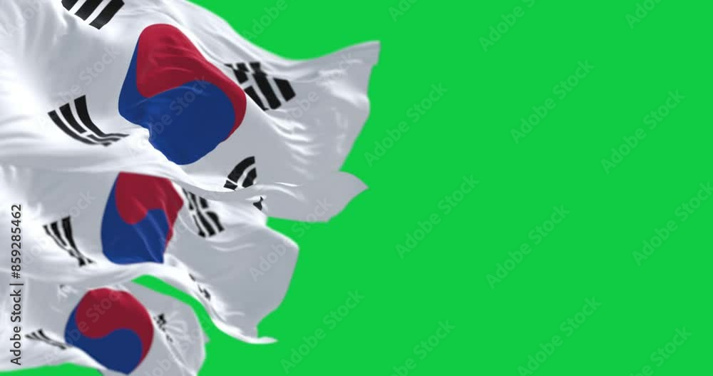 Close-up of South Korea national flags waving isolated on green background Close-up of South Korea national flags waving isolated on green background