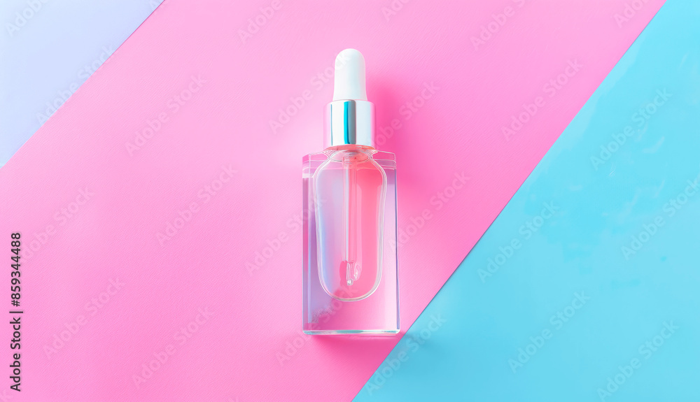 Glass transparent bottle of serum with pipette for skin care on colorful background. Top view. Concept of health, beauty Glass transparent bottle of serum with pipette for skin care on colorful background. Top view. Concept of health, beauty