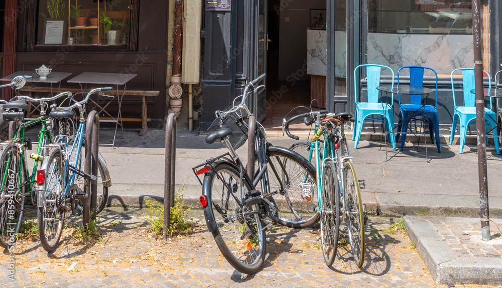 Bicycles parked in front of a delicatessen store in Paris Bicycles parked in front of a delicatessen store in Paris