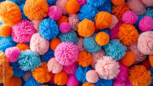 Colorful and fluffy pom poms of different sizes. photo