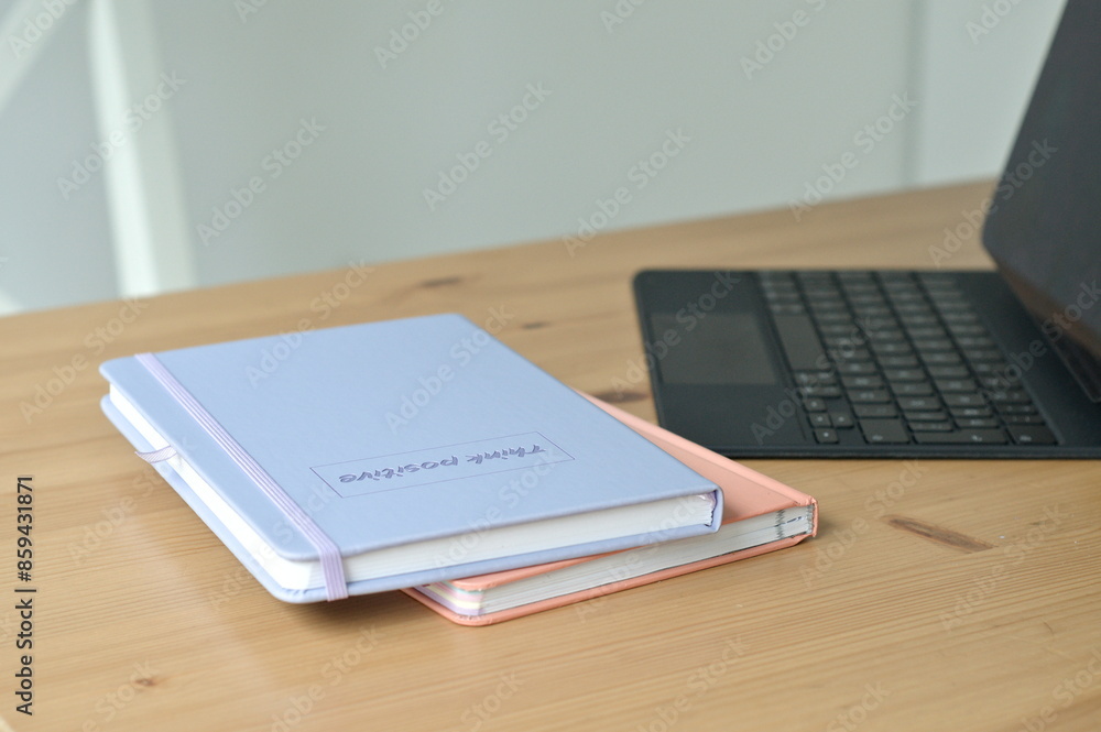 notebooks on wooden table and laptop notebooks on wooden table and laptop