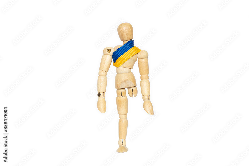 A wooden man without a leg with a Ukrainian flag on his chest will lose his leg in the war A wooden man without a leg with a Ukrainian flag on his chest will lose his leg in the war
