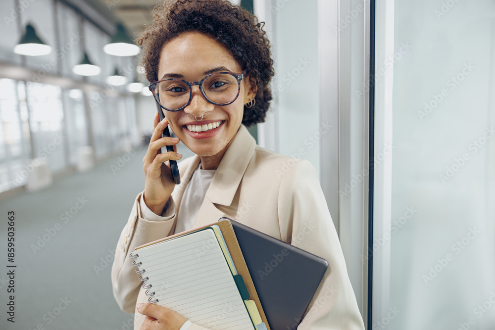 Fototapeta premium Stylish woman sales manager talking by phone with client standing on coworking background 