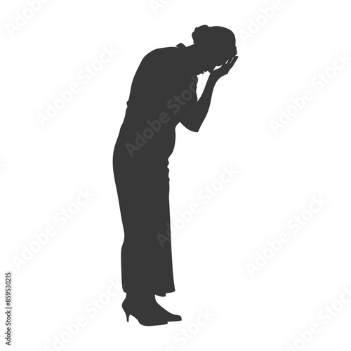 Silhouette of woman bowed over, hands on face, grief or shame, full figure.