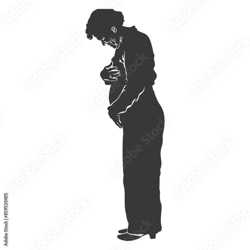 Silhouette of a pensive pregnant woman embracing her abdomen, viewed from the side.