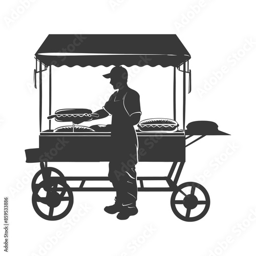Silhouette of street vendor preparing hot dogs at his vintage mobile cart.
