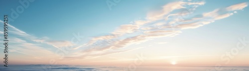 Scenic view of a serene ocean at sunrise with soft pastel colors in the sky and gentle waves capturing the calm and beauty of nature