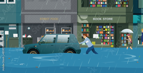 A man was pushing a car that had been damaged by rain and flooding.
