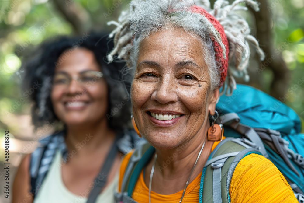 Mature Multiracial Female Couple Enjoying a Nature Hike in Summer Mature Multiracial Female Couple Enjoying a Nature Hike in Summer