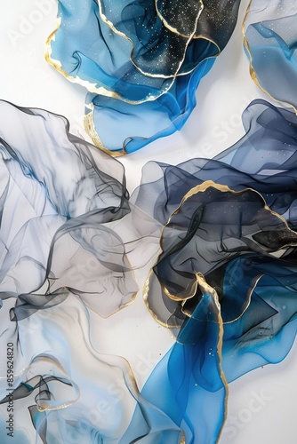 Alcohol ink painting of transparent and flowing chiffon, on a white background with gold foil accents, an abstract floral design in shades of blue photo