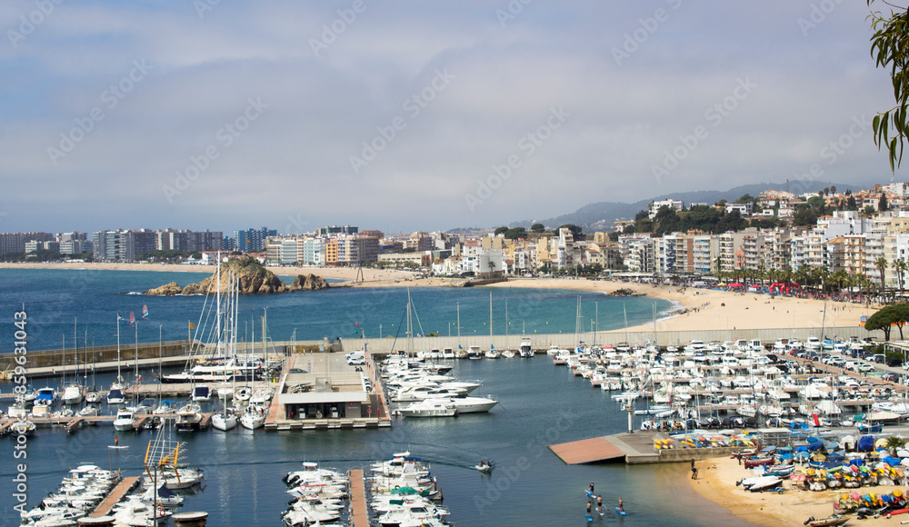 View of the city and embankment on the summer day. Blanes. Spain. View of the city and embankment on the summer day. Blanes. Spain.