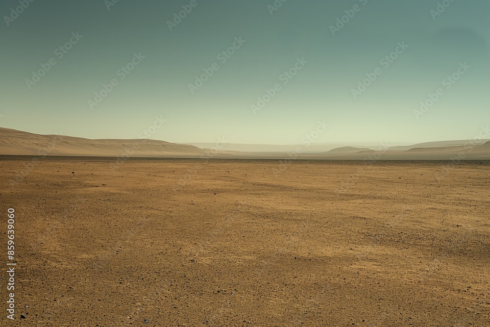 Fototapeta premium Barren desert landscape depicting solitude and vastness under a clear sky