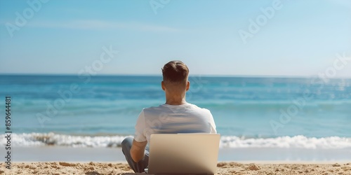Man works on laptop at beach with remote work sign in background. Concept Remote Work, Beach Productivity, Digital Nomad, Laptop Lifestyle photo