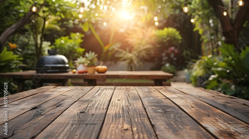 Empty wooden table and blurred bbq in the backyard background, for product display montage