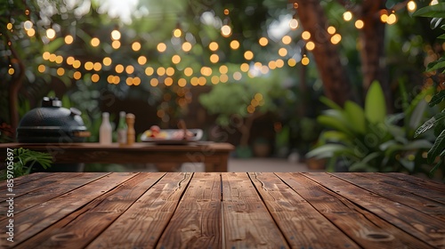 Empty wooden table and blurred bbq in the backyard background, for product display montage