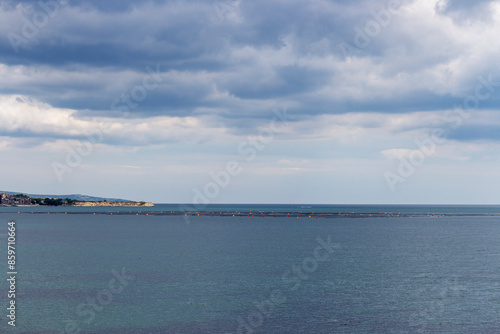 Wallpaper Mural Cloudy view from the Bulgarian Black Sea coast near the Fishing port of Ravda with fishing nets, dalyan in the water, Nesebar municipality, Burgas Province,  Torontodigital.ca