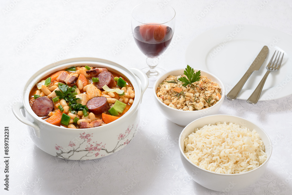 a bowl with chicken cassoulet on a white table a bowl with chicken cassoulet on a white table