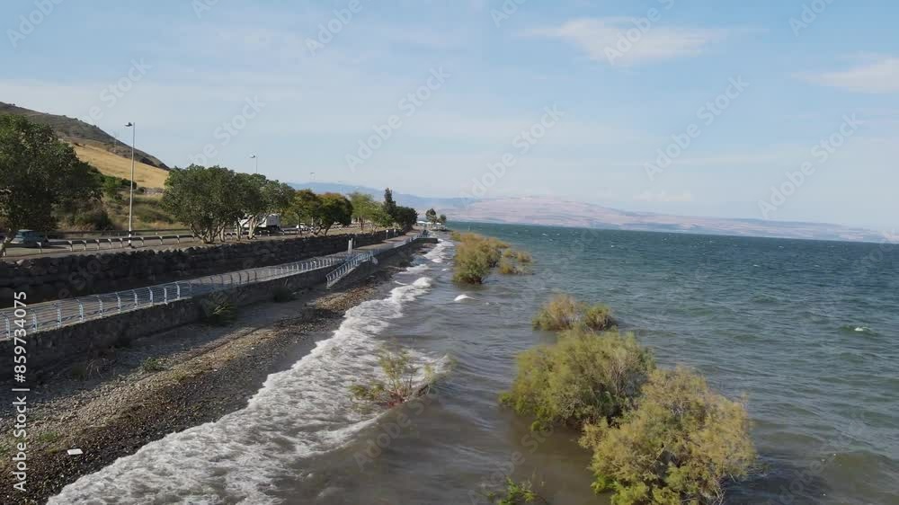 Aerial View Of Sea Waves Rushing Towards Shore At Beach Against Sky - Tiberias, Israel Aerial View Of Sea Waves Rushing Towards Shore At Beach Against Sky - Tiberias, Israel