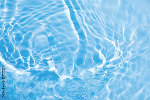 Blue water with ripples on the surface. Defocus blurred transparent blue colored clear calm water surface texture with splashes and bubbles. Water waves with shining pattern texture background.