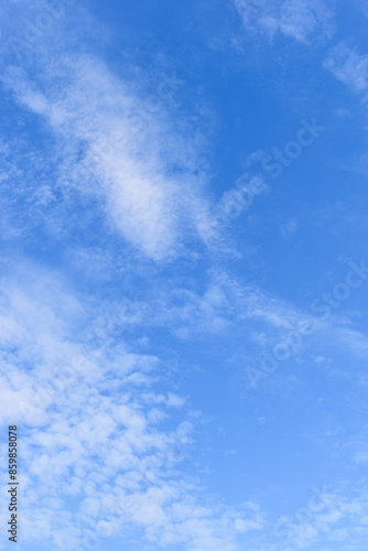 beautiful blue sky and white fluffy group of clouds with sunrise in the morning, natural background © sutichak