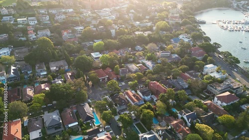 Sydney, Australia: Aerial drone footage of luxury residential real estate in the Bellevue Hill  by the Rose bay in Sydney harbor at sunset in Australia largest city. 