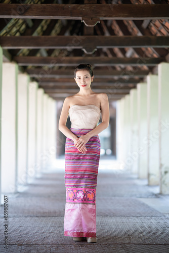 Asian women wearing Lanna dress Traditional Costume Northern Thai cultural costumes in a temple.