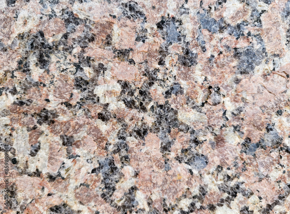 Close-up of the facade of the building, lined with pink marble slabs. Paving slabs in daylight. Natural colors Close-up of the facade of the building, lined with pink marble slabs. Paving slabs in daylight. Natural colors