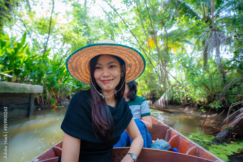 Photography Beautiful asian woman travel on wooden boat in floting market tropical forest ri