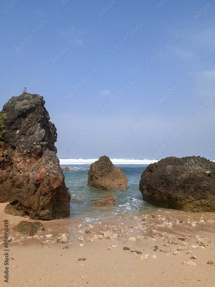 Dynamic Shoreline Symphony: Rocks Embraced by the Ebb and Flow of Crashing Waves Dynamic Shoreline Symphony: Rocks Embraced by the Ebb and Flow of Crashing Waves