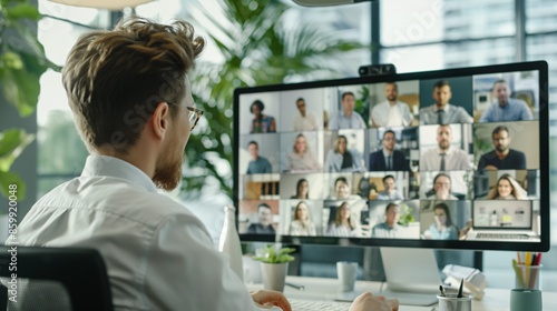 A person setting up a virtual meeting with multiple participants