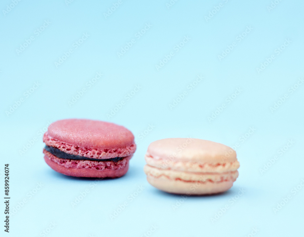 Cookies, candy and display of macaroons with variety, delicacy and treats on blue background. Baked dessert, French sweets and different flavors of confectionery for bakery, fine dining and luxury Cookies, candy and display of macaroons with variety, delicacy and treats on blue background. Baked dessert, French sweets and different flavors of confectionery for bakery, fine dining and luxury