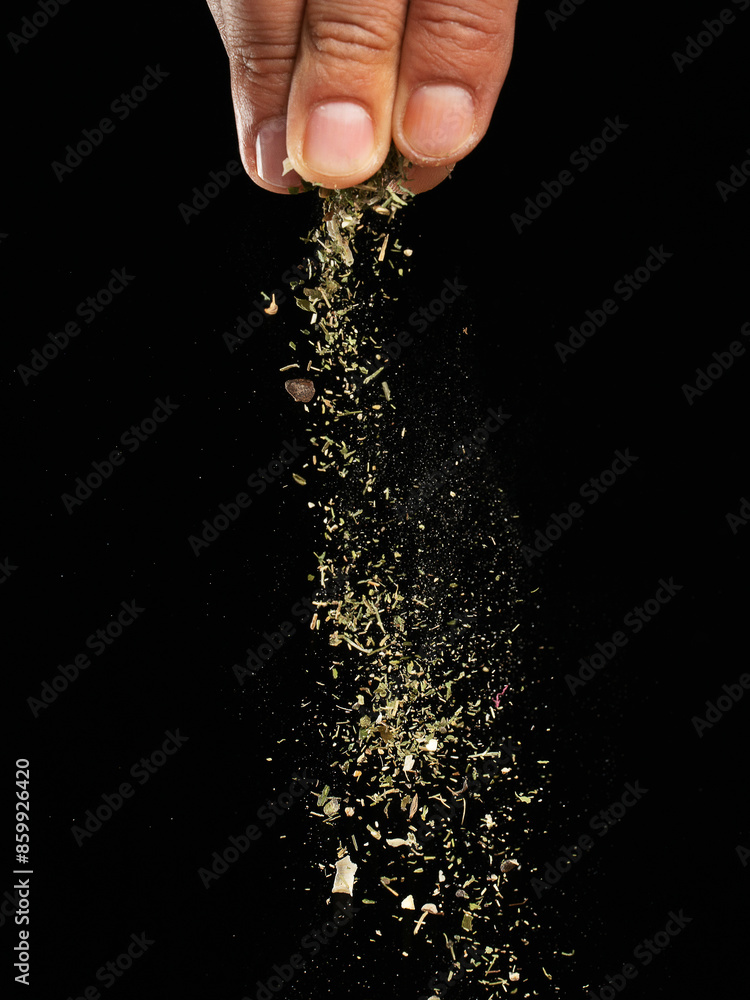 Fototapeta premium Spices are sprinkled on a dark background