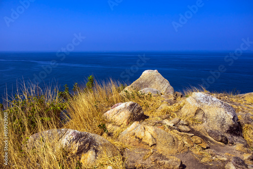 Rock and blue sky sea way to Krating cape in summer Phuket Thailand