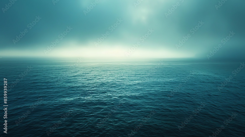 Obraz premium Tranquil ocean scene with a misty, ethereal sky.