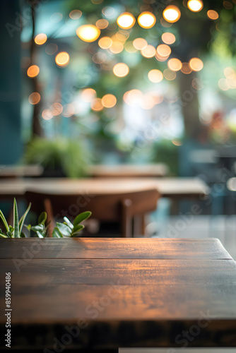 Warm and Inviting Wooden Table in a Cozy Cafe Setting with Blurred Background © slonme