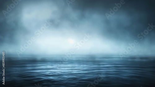 Calm ocean water with a misty sky above.