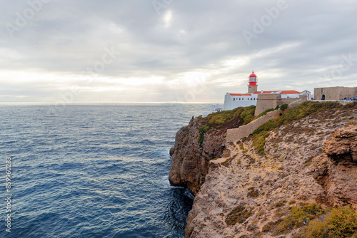 lighthouse on the high cliffs of Cape St. Vincent. The most southwestern point of mainland Europe. natural landscape of the Atlantic Ocean, rocky coast at Cabo de Sao Vicente in the Algarve, Portugal