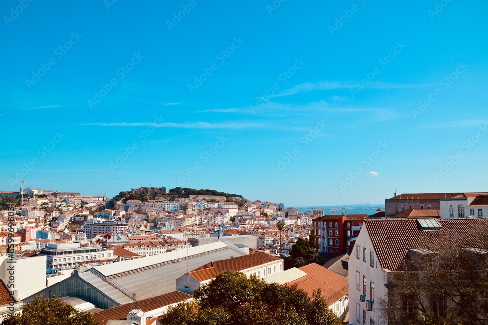 Fototapeta premium Aerial view of the city of Lisbon, Portugal under a blue sky